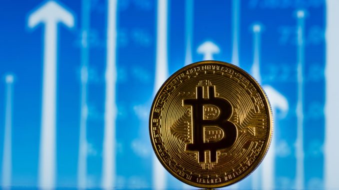 Unity COO: It's "disingenuous" to say Trump's win directly caused An image of a Bitcoin in front a background with arrows pointing up